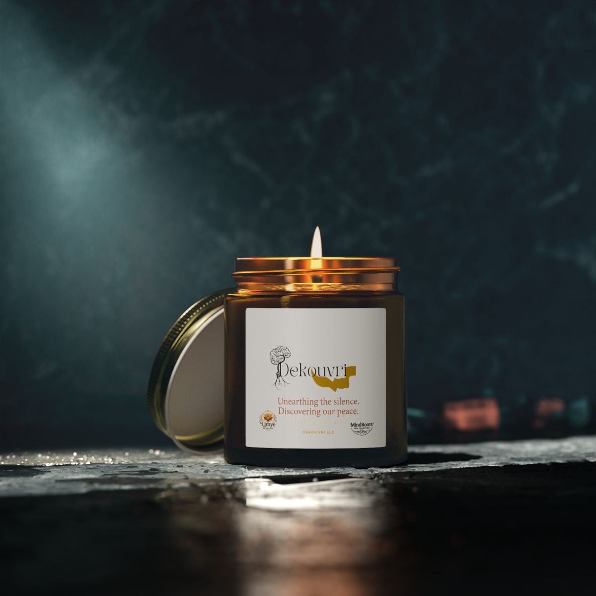 Lit Saffron Gold Limy&egrave; Candle in an amber glass jar